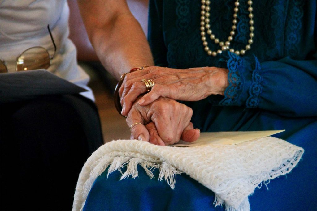 residents holding hand