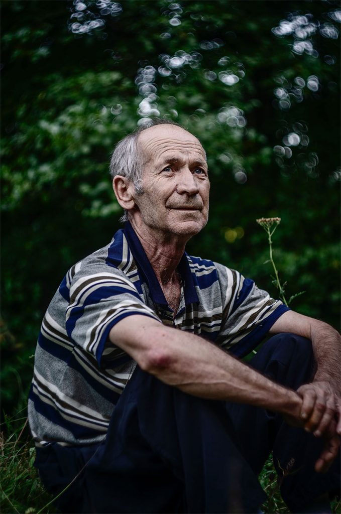 old man sitting in the garden