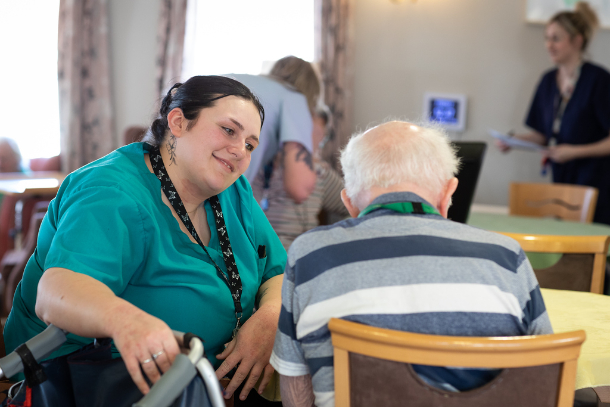 care giver speaking to resident